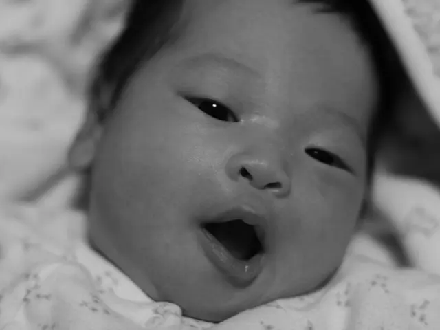 Reasons behind baby's wheezing: Identifying causes and potential remedies.