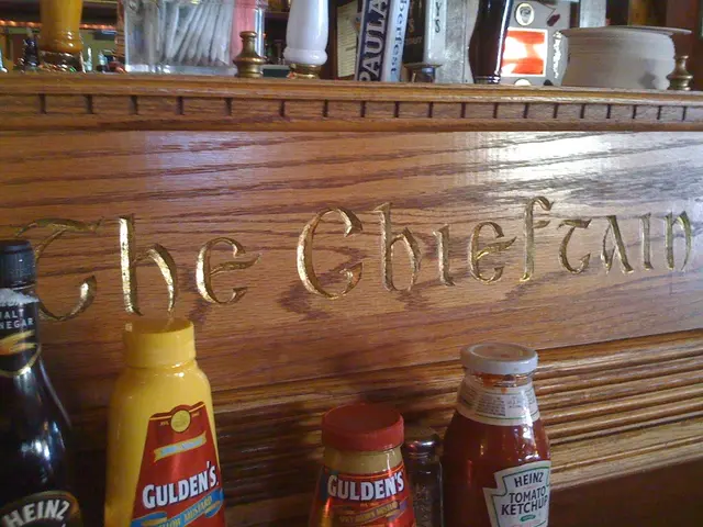 We can see a wine bottle and few other bottles at the wooden board.