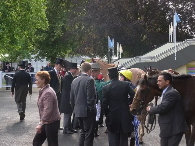 In this image I see number of people and few horses over here. In the background I see the flags...