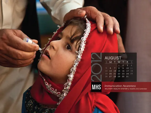In this image we can see few people standing and a person is holding a vaccine bottle and there is...