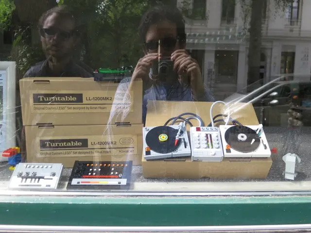 These are the electronic devices and the cardboard boxes, which are placed on the table. I think...