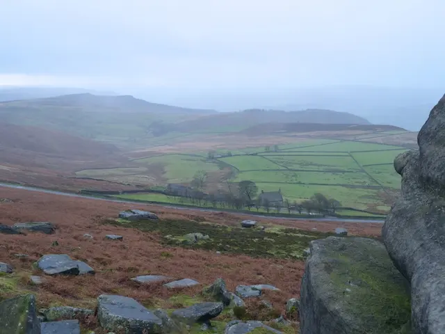 It is a beautiful scenery, there are huge rocks, stones and behind them there are many crops and...